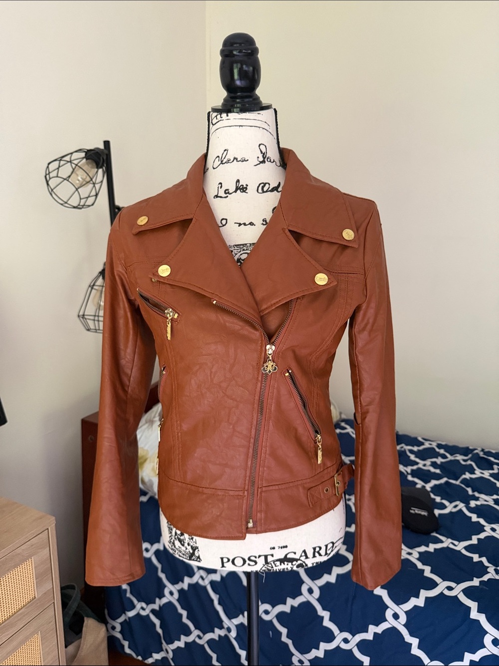 Dereon Women's Faux Leather Moto Jacket in Rust with Gold Hardware